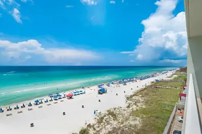 a view of the beach from the balcony of a resort at Marisol 501 in Panama City Beach