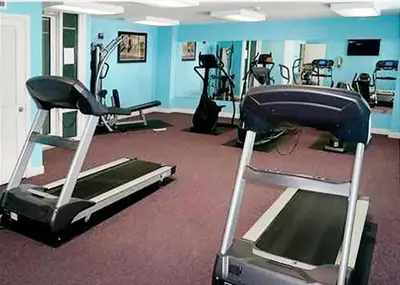 a gym with several exercise equipment in a room at Marisol 501 in Panama City Beach