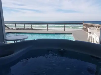 a bath tub with a view of the ocean at Making Waves - Huge Heated Beachfront Pool & Hot Tub! Best In Pcb! in Panama City Beach