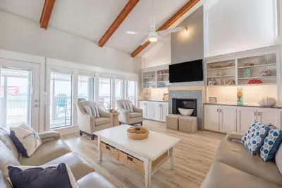 a living room with a couch and a table at Fantasea - Wonderful Private Beachfront Home - Beautiful!!! in Panama City Beach