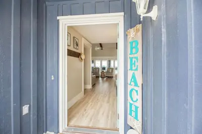 a blue room with a mirror and a blue wall at Fantasea - Wonderful Private Beachfront Home - Beautiful!!! in Panama City Beach