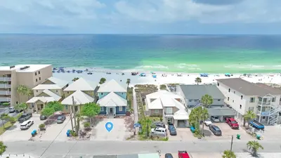 an aerial view of a beach with buildings and the ocean at The Tourist Trap - Heated Private Beachfront Pool! Gorgeous!!! in Panama City Beach