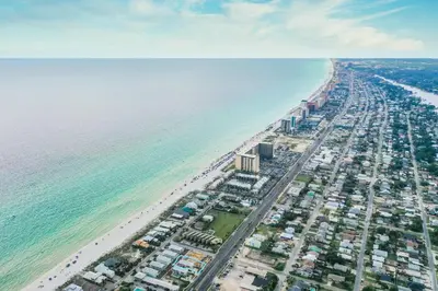 an aerial view of a beach and the ocean at Hook, Wine & Sinker - Private Pool! Brand New! in Panama City Beach