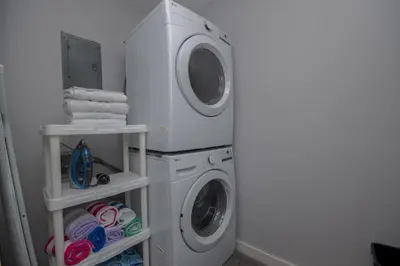 a washing machine and a dryer in a bathroom at Island Time- Wonderful Private Beachfront Home - Beautiful!!! in Panama City Beach