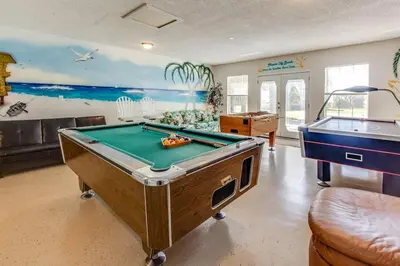 a billiard room with a pool table and a pool table at Gulf View Home - Private Pool! in Panama City Beach