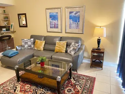 a living room with a couch and a coffee table at Boardwalk 805 in Panama City Beach