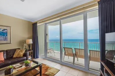 a living room with a view of the ocean at Boardwalk 805 in Panama City Beach