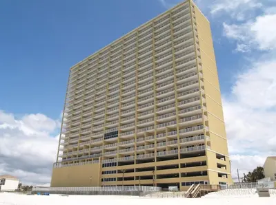 a tall building with a lot of balconies at Tropic Winds Condo in Panama City Beach