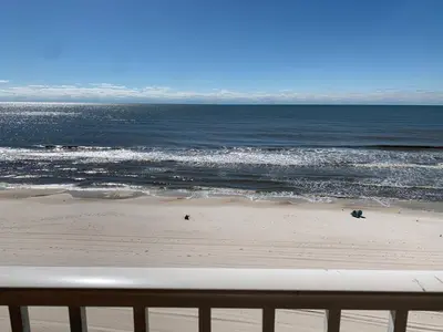 a view of the ocean from a balcony of a beach at Tropic Winds Condo in Panama City Beach