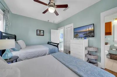 a bedroom with two beds and a ceiling fan at Four Fish Bungalow 155 in Santa Rosa Beach