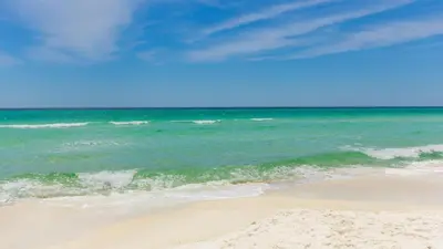 a sandy beach with the ocean in the background at Four Fish Bungalow 155 in Santa Rosa Beach