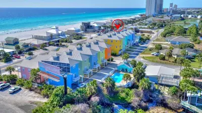 an aerial view of a resort with the beach in the background at Sun Of A Beach - Beautiful Home Next To Pier Park - Swimming Pool! in Panama City Beach