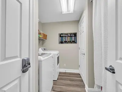 a laundry room with a washer and dryer at Calypso 2-1902 West in Panama City Beach