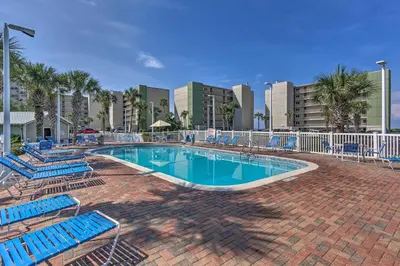a swimming pool with lounge chairs and a resort at Pinnacle Port Getaway with Ocean View and Pool Access! in Panama City