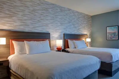 a hotel room with two beds and two lamps at Home2 Suites By Hilton Panama City Beach, Fl in Panama City Beach