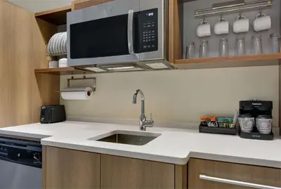 a kitchen with a sink and a microwave at Home2 Suites By Hilton Panama City Beach, Fl in Panama City Beach