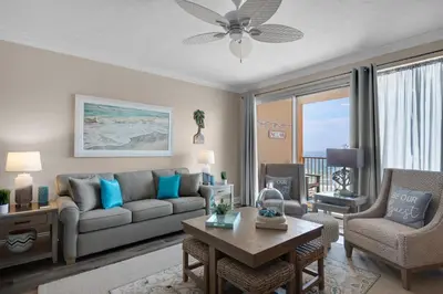 a living room with a couch and a table at Treasure Island 0205 in Panama City Beach