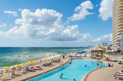 a view of the beach and a swimming pool at a resort at Treasure Island 0207 in Panama City Beach