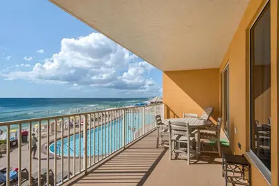 a balcony with a view of the beach and the ocean at Treasure Island 0207 in Panama City Beach