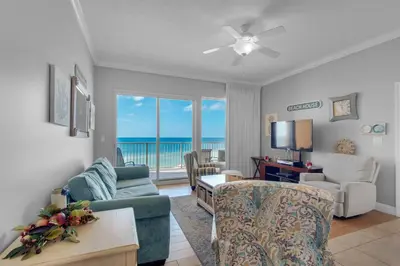 a living room with a view of the ocean at Treasure Island 0305 in Panama City Beach