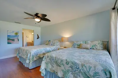 a bedroom with two beds and a ceiling fan at Nautical Edgewater Resort Condo - Walk to Beaches! in Panama City Beach
