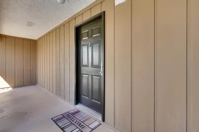 a door on the side of a building with a floor at Nautical Edgewater Resort Condo - Walk to Beaches! in Panama City Beach