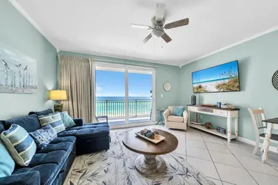 a living room with a couch and a table at Splash 303E in Panama City Beach