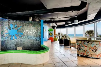 a lobby of a resort with a splash wall at Splash 303E in Panama City Beach