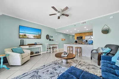 a living room with a couch and a table at Splash 303E in Panama City Beach
