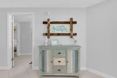 a wooden dresser in a room with a wall at Grandview East 304 in Panama City Beach