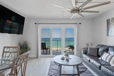 a living room with a couch and a table at The Summit 615 in Panama City Beach