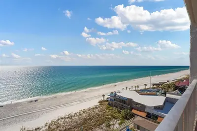 a view of the beach from the balcony of a condo at The Summit 1006 in Panama City Beach