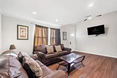 a living room with a couch and a table at 5218 Beach Dr A in Panama City Beach
