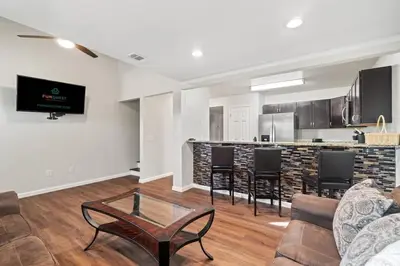 a living room with a couch and a table at 5218 Beach Dr A in Panama City Beach
