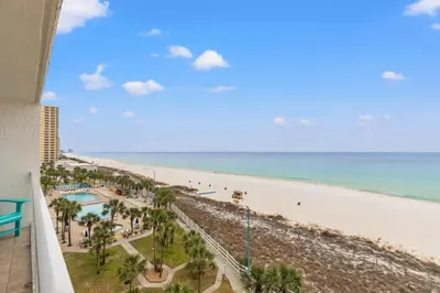 a view of the beach from the balcony of a resort at The Summit 701 in Panama City Beach