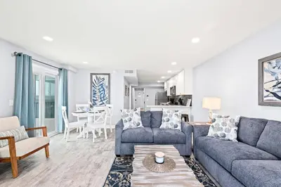a living room with a couch and a table at The Summit 701 in Panama City Beach
