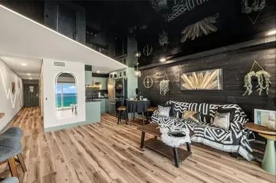 a living room with a couch and a table at The Summit 1107 in Panama City Beach