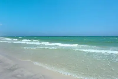 a view of the ocean from the beach at Brightly Furnished Beachfront Condominium by Brightwild in Panama City Beach
