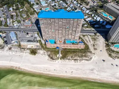 an overhead view of a building on the beach at Brightly Furnished Beachfront Condominium by Brightwild in Panama City Beach