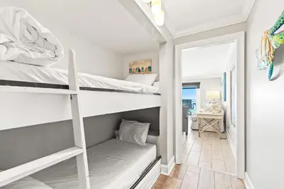 two bunk beds in a room with a hallway at The Summit 1121 in Panama City Beach