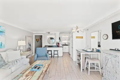 a living room with a couch and a table at The Summit 1121 in Panama City Beach