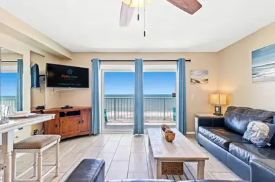 a living room with a couch and a table at The Summit 1011 in Panama City Beach