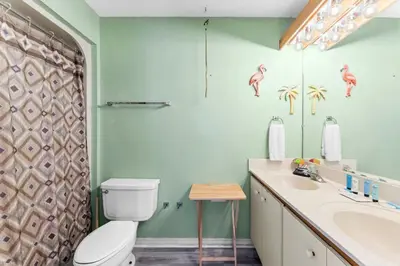 a bathroom with a toilet and a sink at 1302B St Thomas Square in Panama City Beach