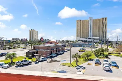 a parking lot with cars parked in a parking lot at 1302B St Thomas Square in Panama City Beach
