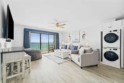 a living room with a couch and a table at The Summit 602 in Panama City Beach
