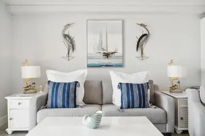 a living room with a couch and two chairs at The Summit 602 in Panama City Beach