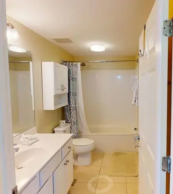 a bathroom with a sink and a toilet and a shower at 8th Floor Gulf View Beachfront Condominium by Brightwild in Panama City Beach