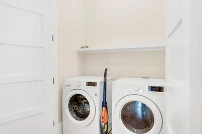 a laundry room with a washer and dryer at Calm Breeze Cottage in Santa Rosa Beach