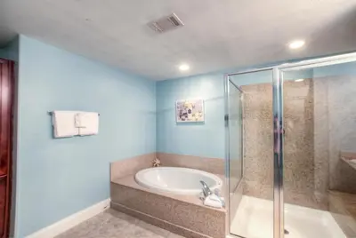 a bathroom with a tub and a shower at BRAND NEW!Laketown Wharf 334! Beautiful 3 BD, Great Amenities, And Great Location in Panama City Beach
