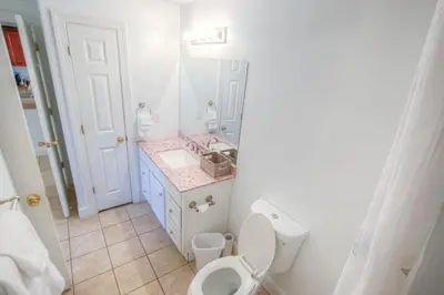 a bathroom with a toilet and a sink at Fantastic Private Complex -Beachfront 2BD Ocean Villa! Gorgeous Amenities in Panama City Beach